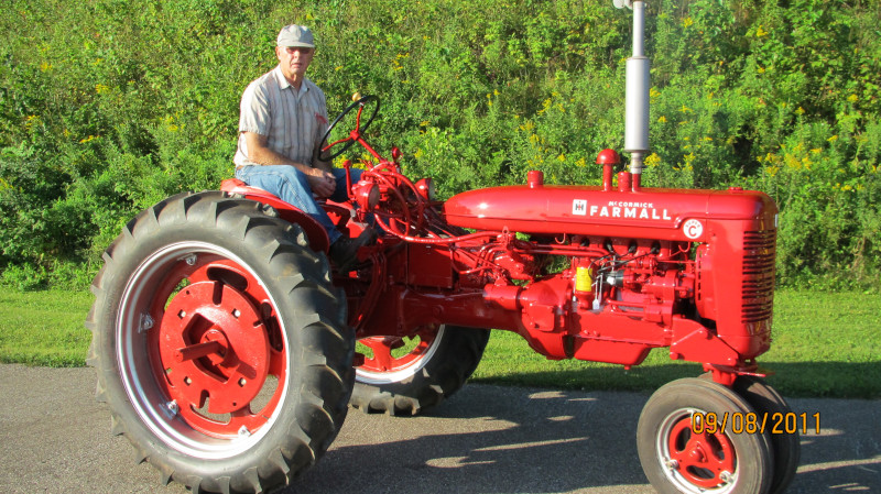 Douglas Fisk With a Farmall Super C.